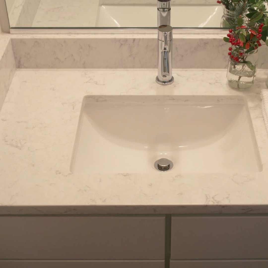 Minuet quartz countertop and undermount sink in a custom bath design - Hello Lovely Studio.