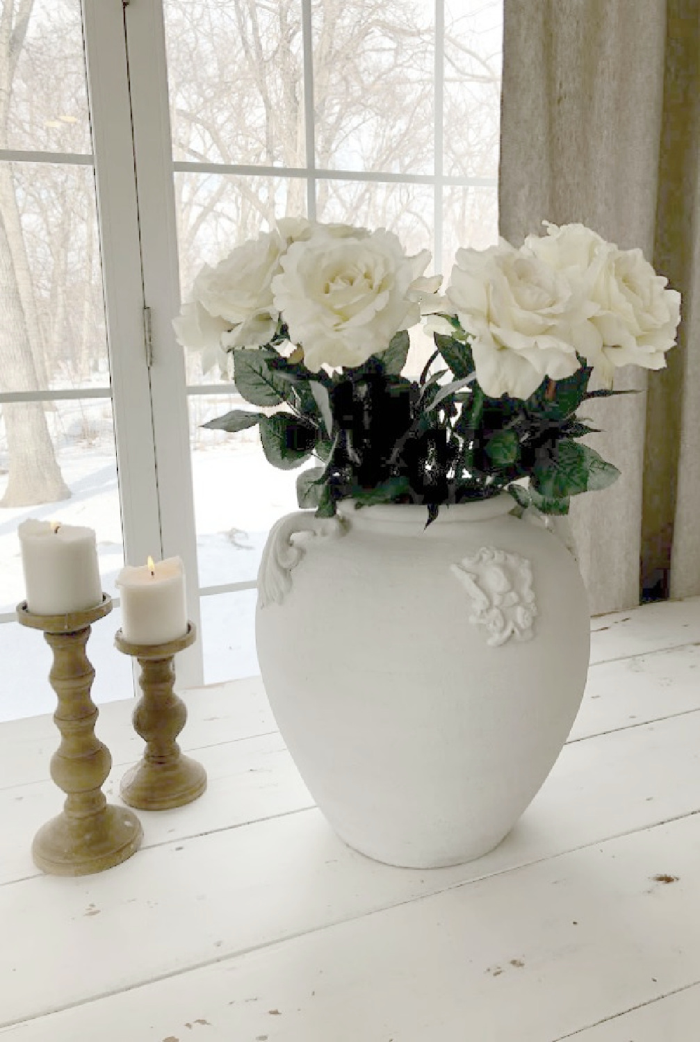 Terracotta urn with white roses on my antique farm table - Hello Lovely.