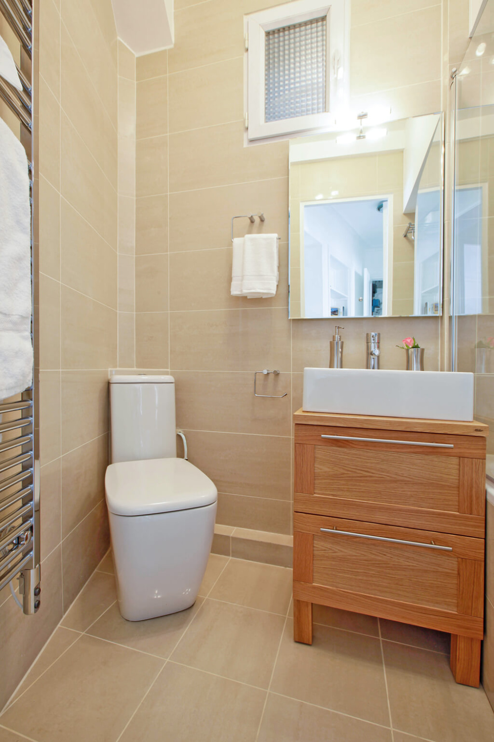 Modern bath with floor to ceiling tile in a Paris apartment near Notre Dame - Hello Lovely Studio.