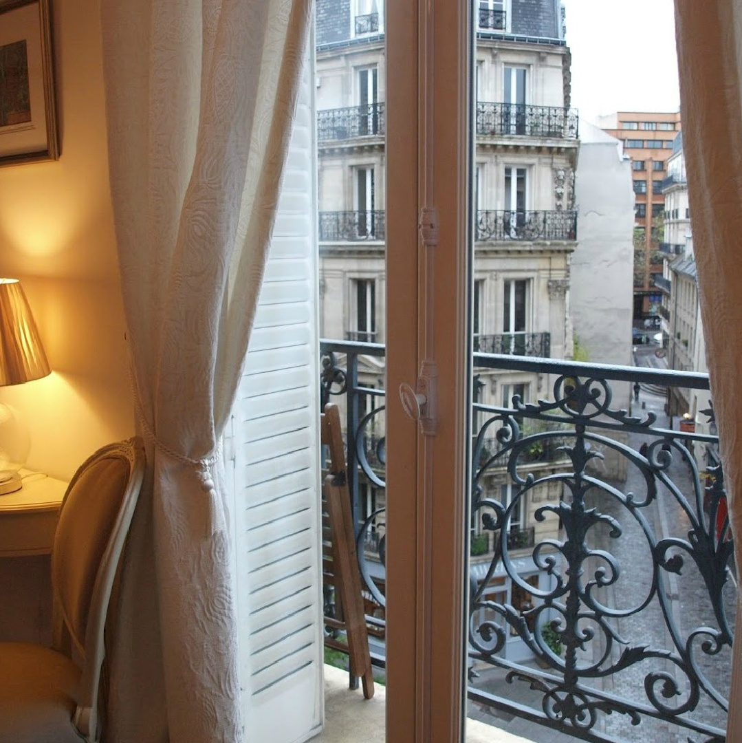 View of Hausmannian buildings from the balcony of our Paris apartment near Notre Dame - Hello Lovely Studio.