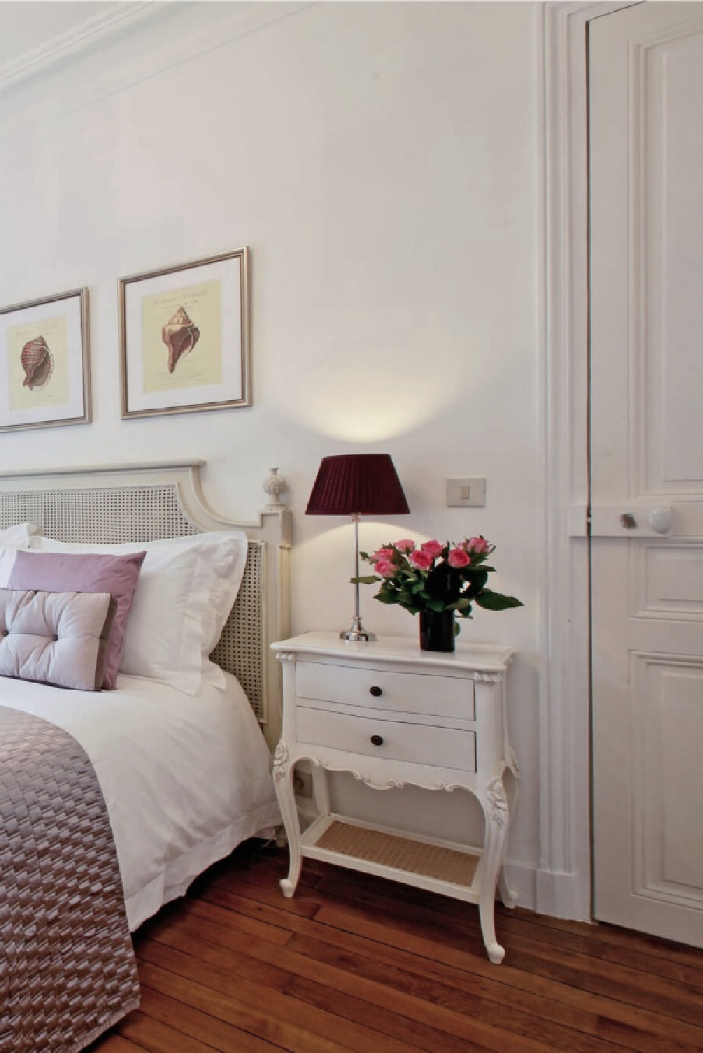 Paris apartment romantic bedroom decor with lavender accents and white walls - Hello Lovely Studio.