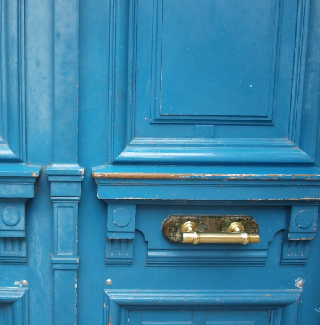 Brilliant slightly teal blue exterior door to a Paris apartment - Hello Lovely Studio.