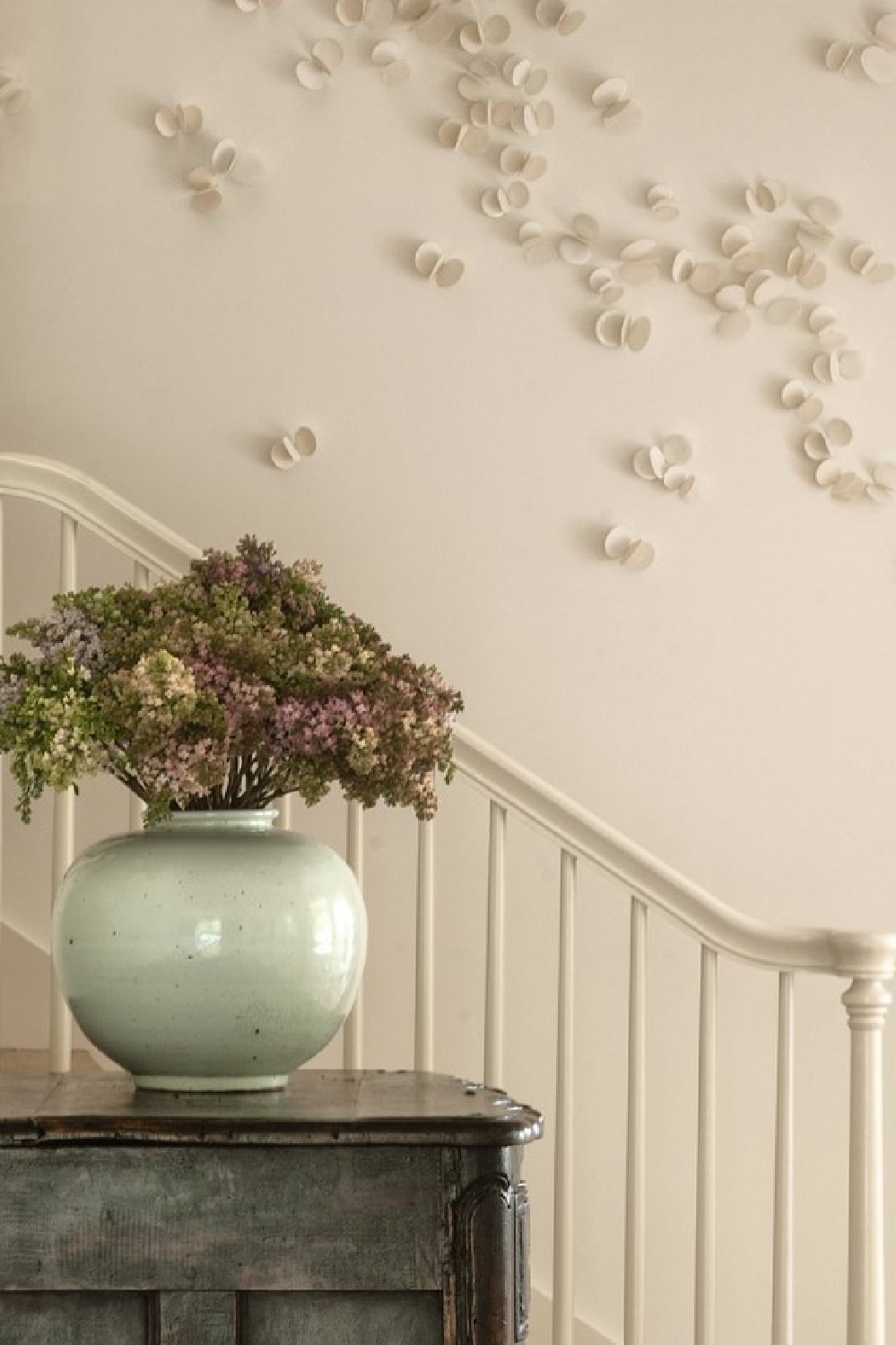 Staircase and contemporary art installation. Timeless interior design by Shannon Bowers with nods to European antiques, patina, understated elegance, and sophisticated simplicity. #shannonbowers #timelessinteriors