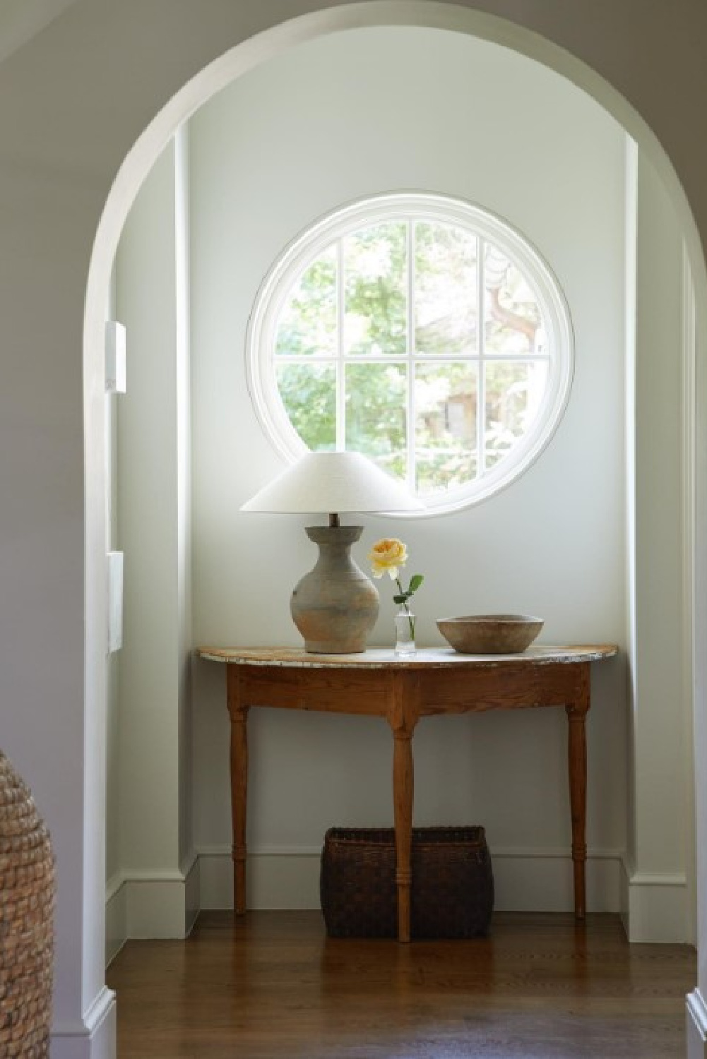 Round window and demilune table. Timeless interior design by Shannon Bowers with nods to European antiques, patina, understated elegance, and sophisticated simplicity. #shannonbowers #timelessinteriors