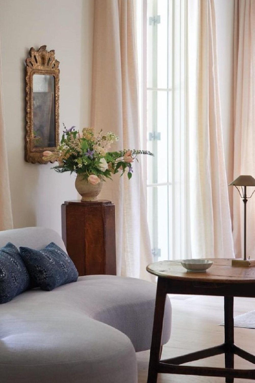 Curved sofa and brass task lamp. Timeless interior design by Shannon Bowers with nods to European antiques, patina, understated elegance, and sophisticated simplicity. #shannonbowers #timelessinteriors