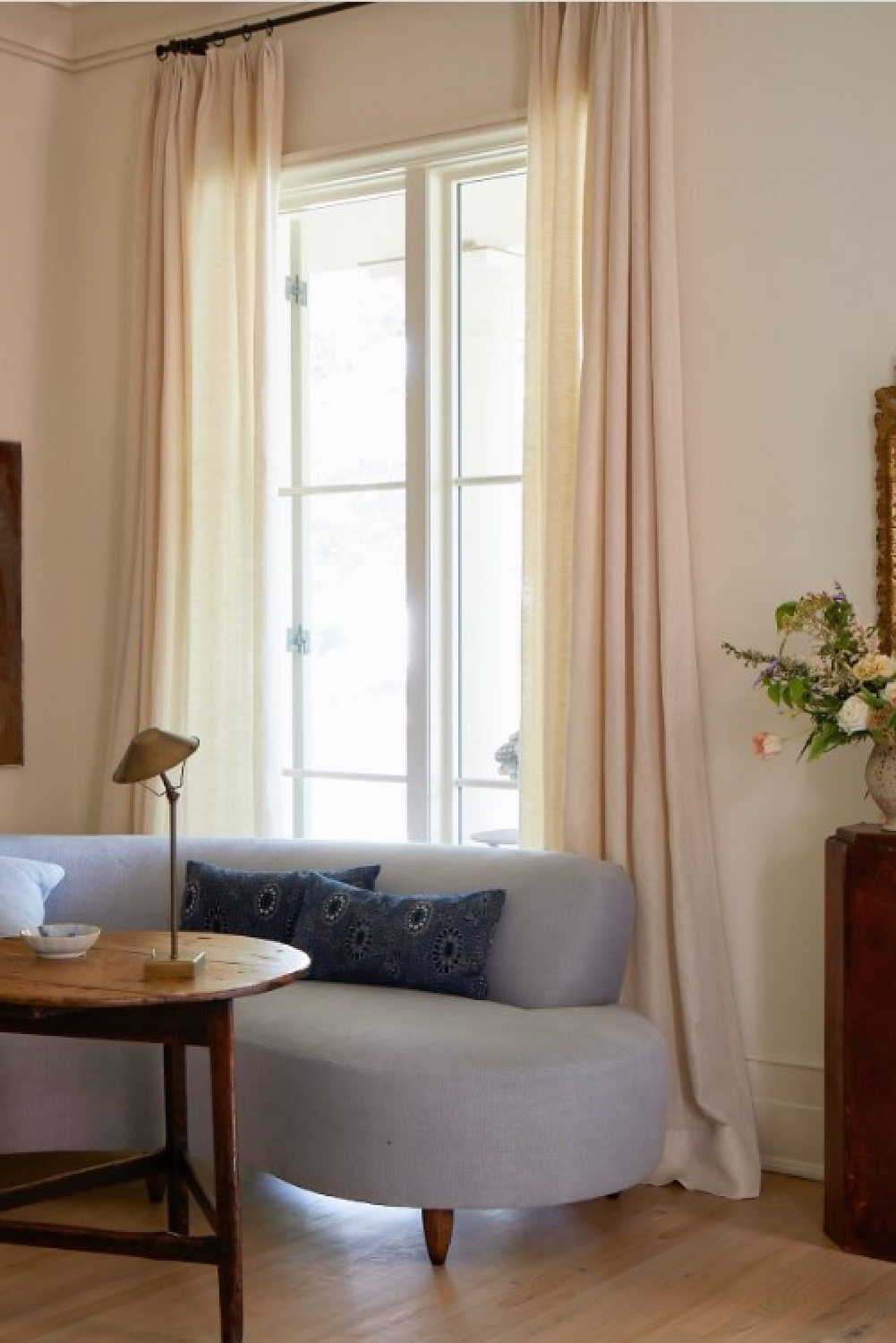 Curved sofa and brass task lamp. Timeless interior design by Shannon Bowers with nods to European antiques, patina, understated elegance, and sophisticated simplicity. #shannonbowers #timelessinteriors