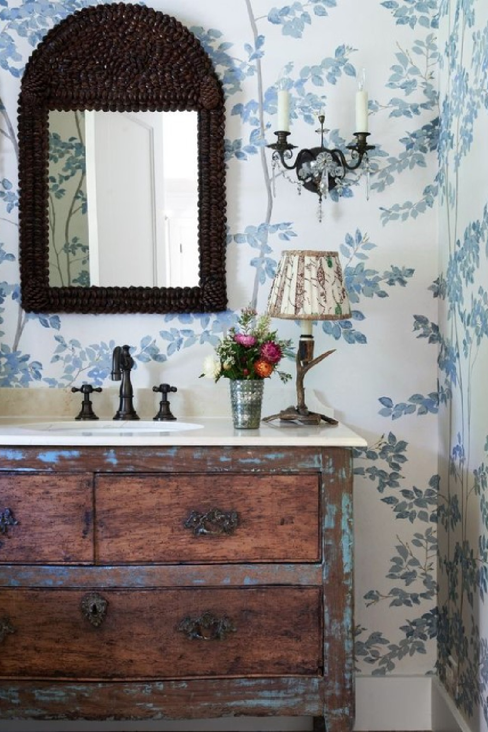 Lake cabin powder bath with antique vanity. Timeless interior design by Shannon Bowers with nods to European antiques, patina, understated elegance, and sophisticated simplicity. #shannonbowers #timelessinteriors