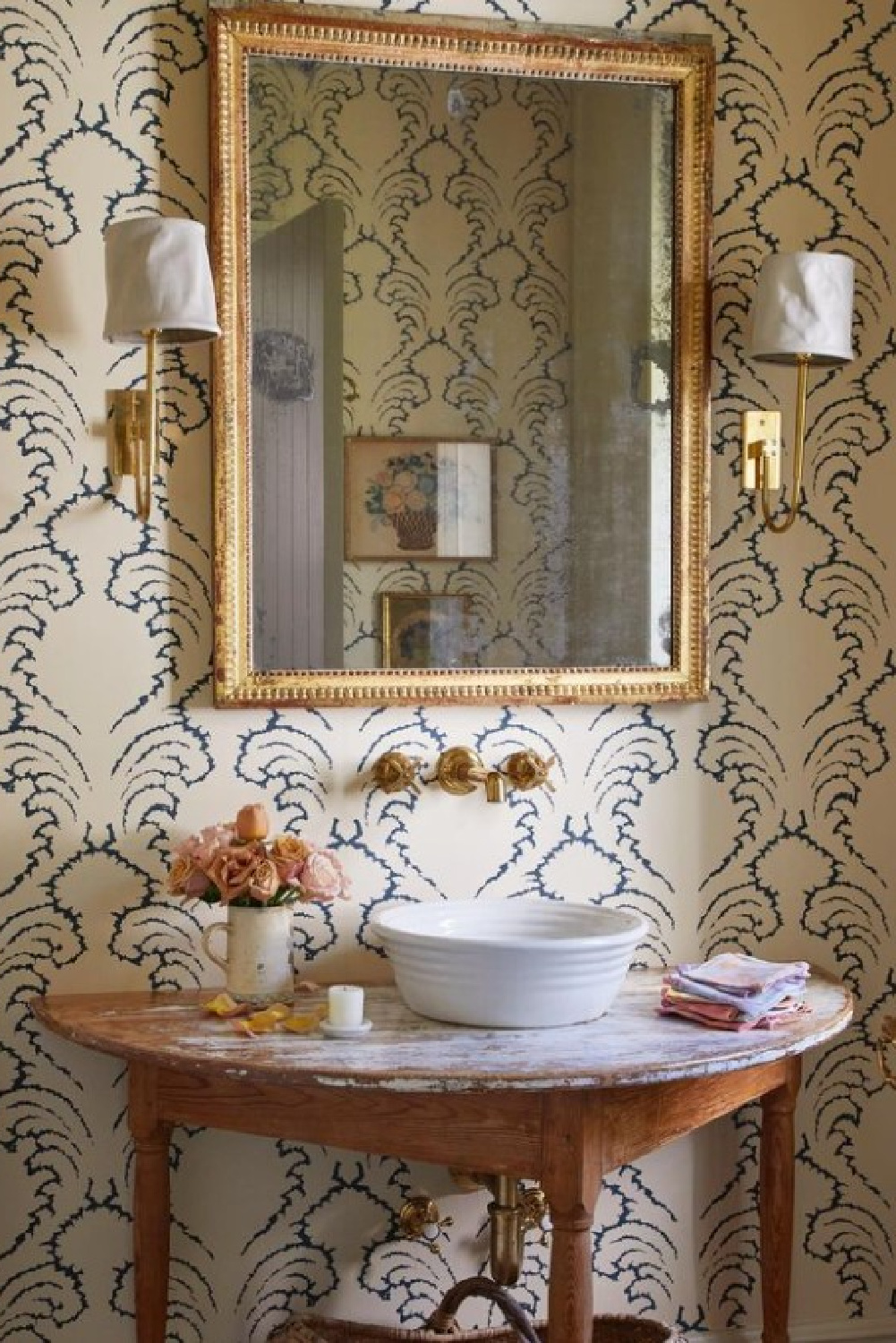 Beautiful powder bath with fresh roses. Timeless interior design by Shannon Bowers with nods to European antiques, patina, understated elegance, and sophisticated simplicity. #shannonbowers #timelessinteriors