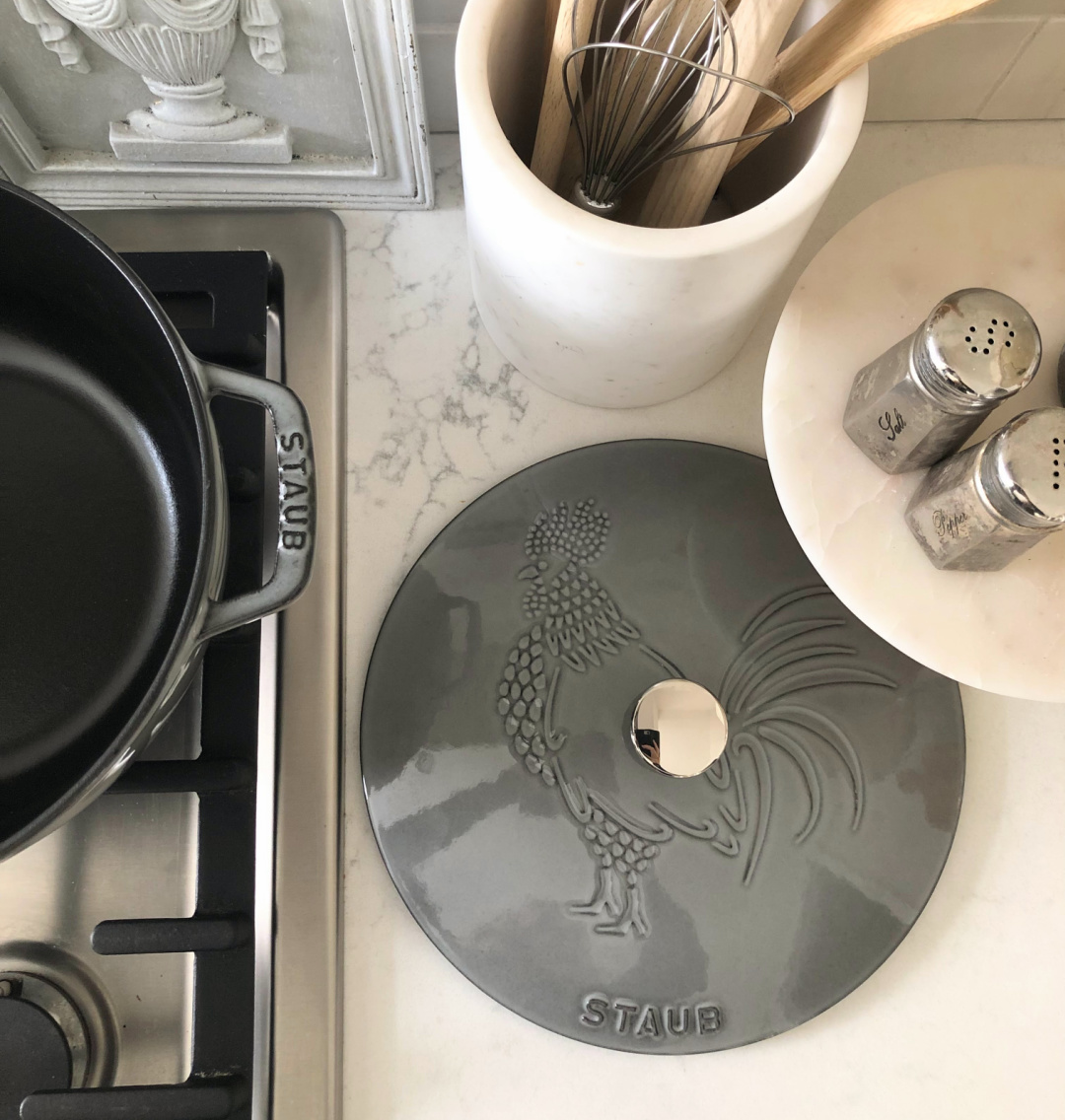 Staub French Oven with Rooster in Graphite Grey on my Muse quartz counter in our Modern French kitchen - Hello Lovely Studio. #staub #frenchkitchens