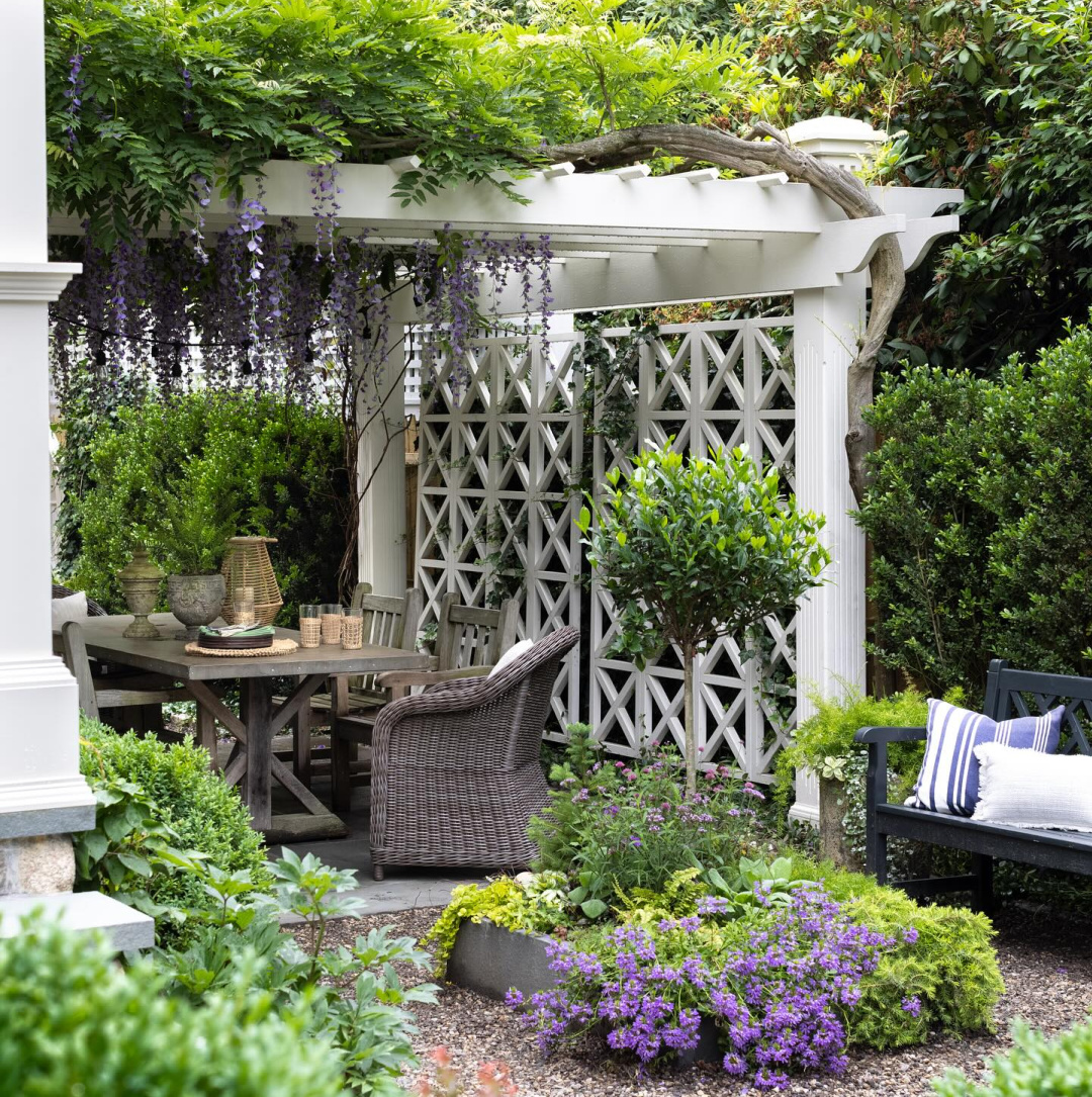 Pergola, dining area, and lush foliage - Mar Jenning's beautiful gardens (Rosebrook Gardens) in Westport, CT. #gardeninspiration