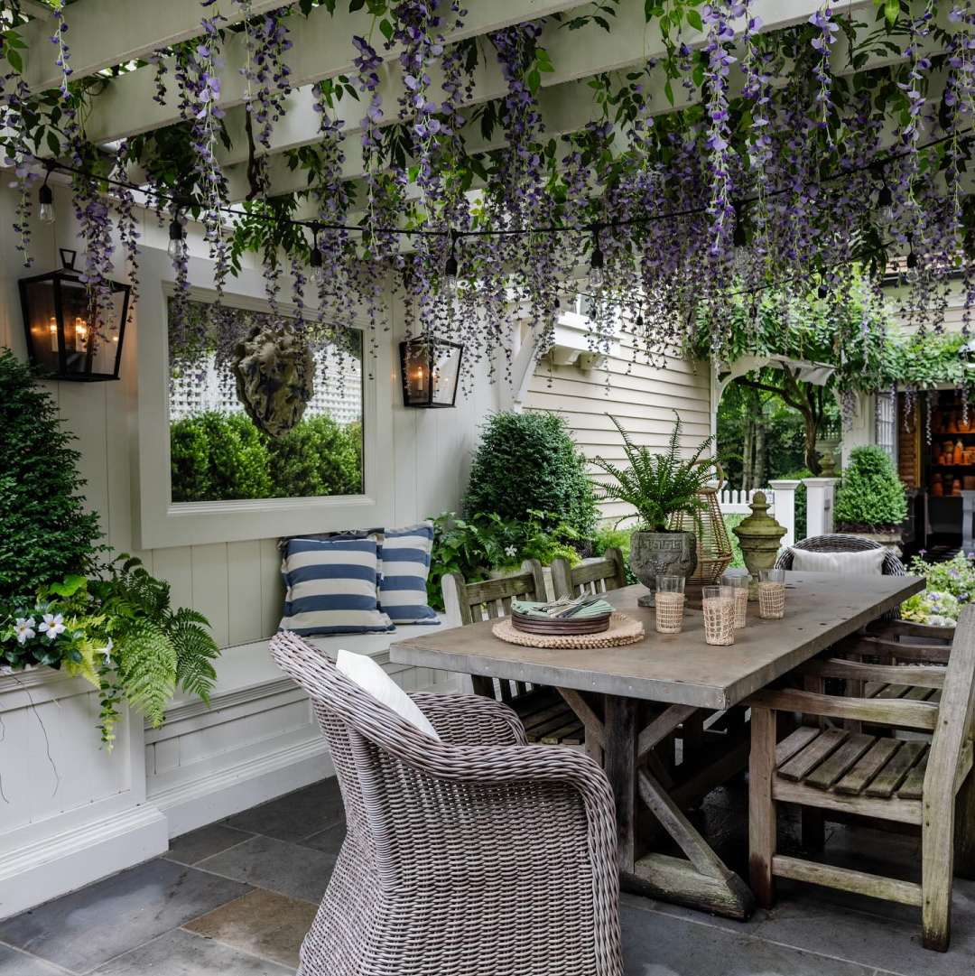 Wisteria covered pergola in outdoor dining area - Mar Jenning's beautiful gardens (Rosebrook Gardens) in Westport, CT. #gardeninspiration