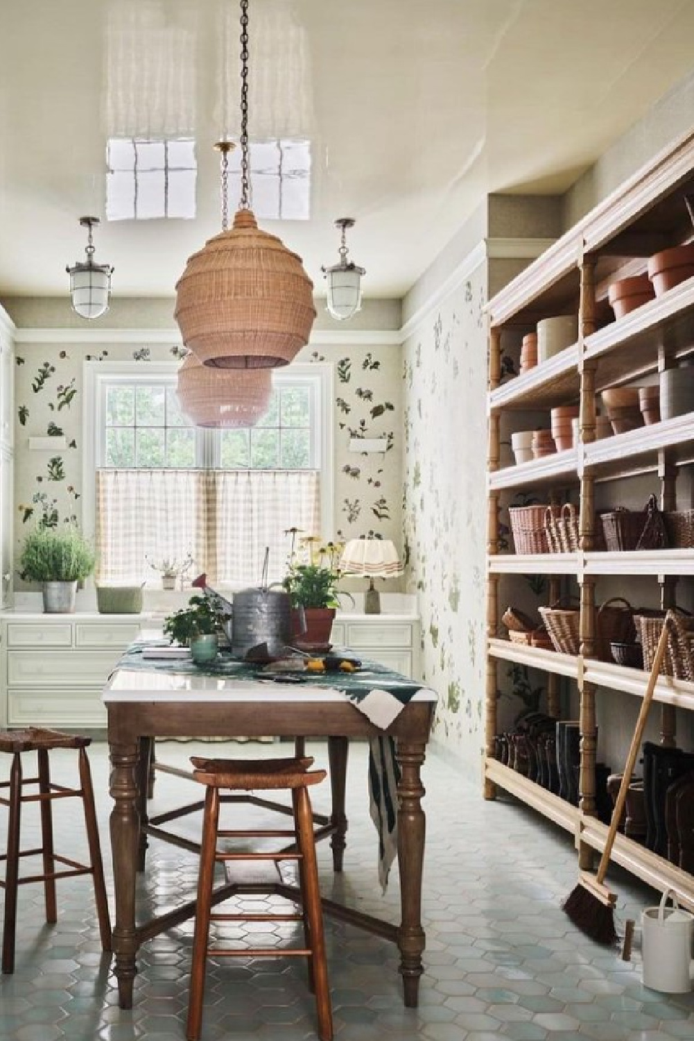 English country mud room with baskets, shelves and work table - @jessicajubelirer