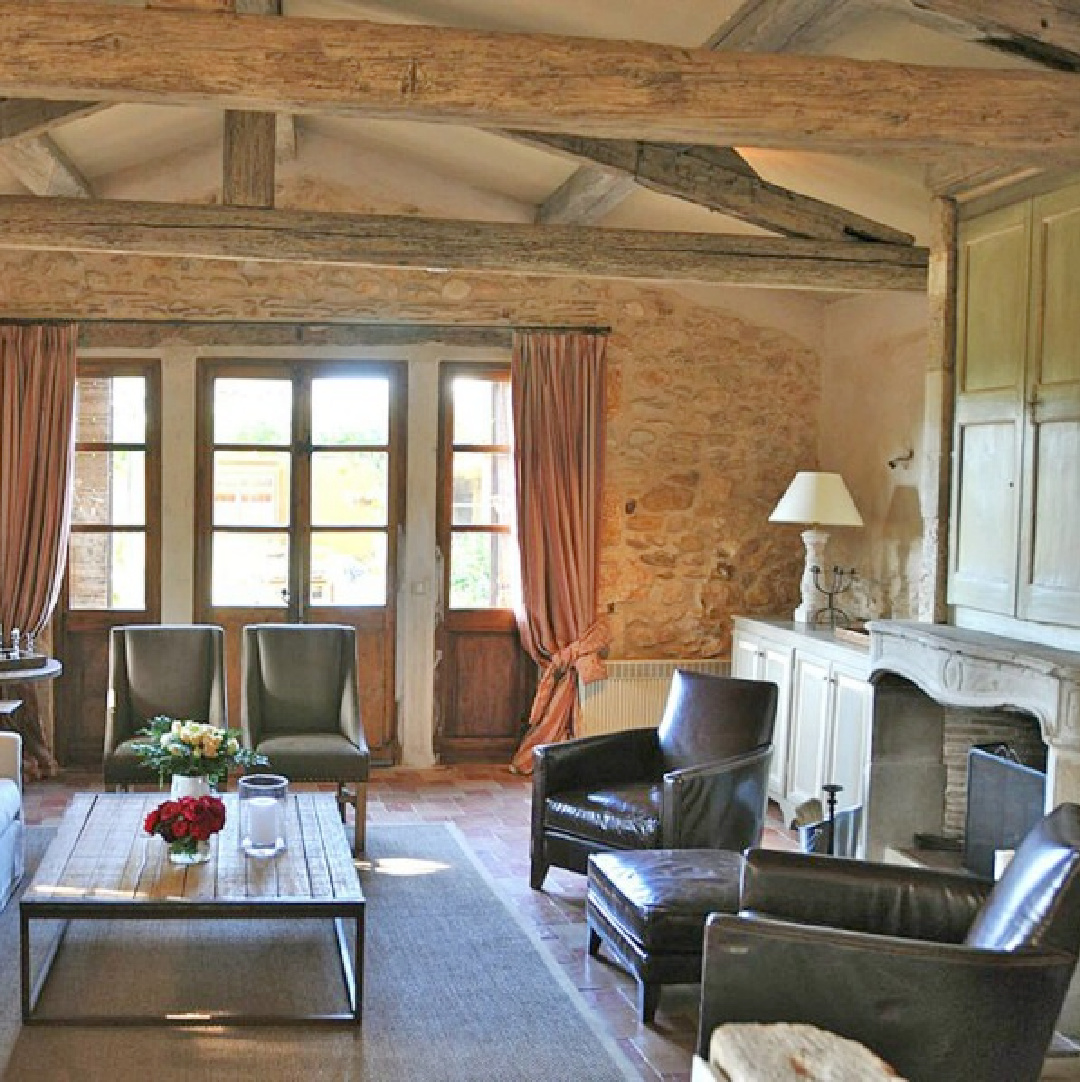 Old World style living room with stone walls, arched windows, shutters, and charming French country charm - Bonnieux villa in Provence (Your Haven in Paris).