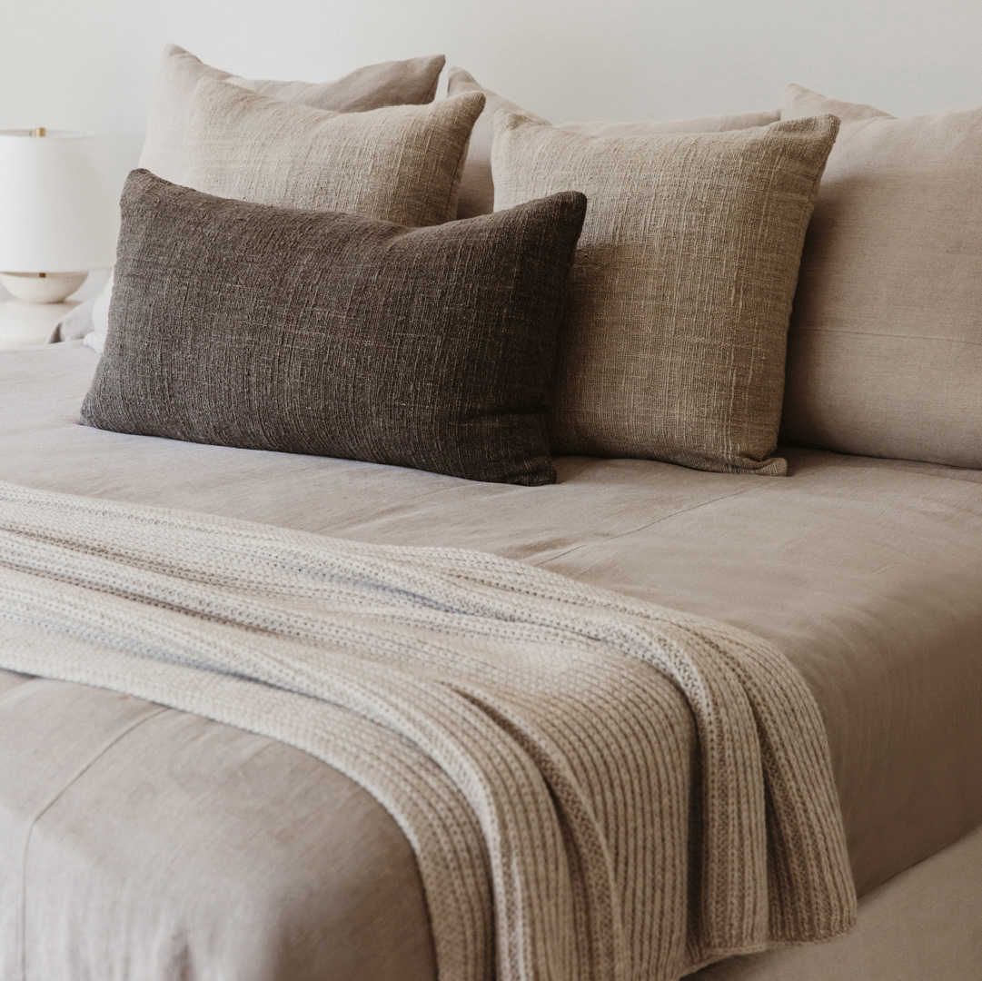 Jenni Kayne Home serene neutral bedroom with linen and natural materials.