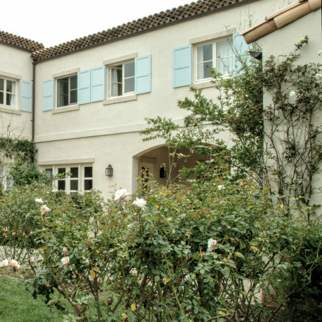 Nancy Meyers Provencal home in Los Angeles before renovation with its blue shutters.