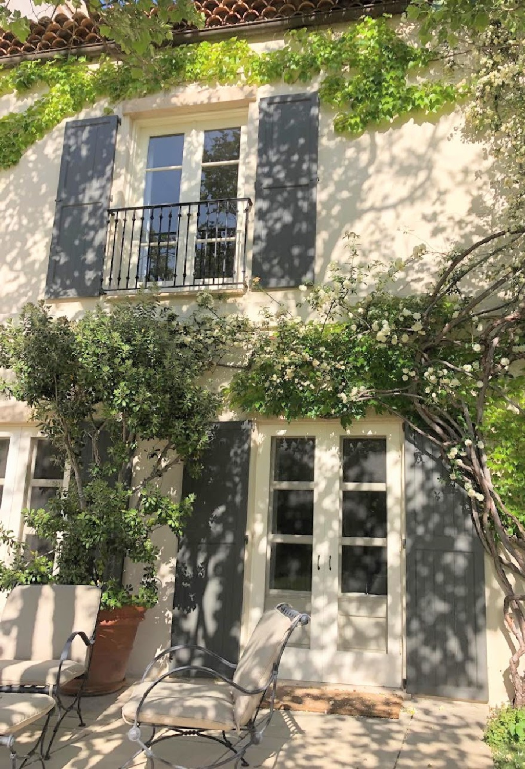 Nancy Meyers Provencal home in Los Angeles after renovation with its gray shutters. #nancymeyers