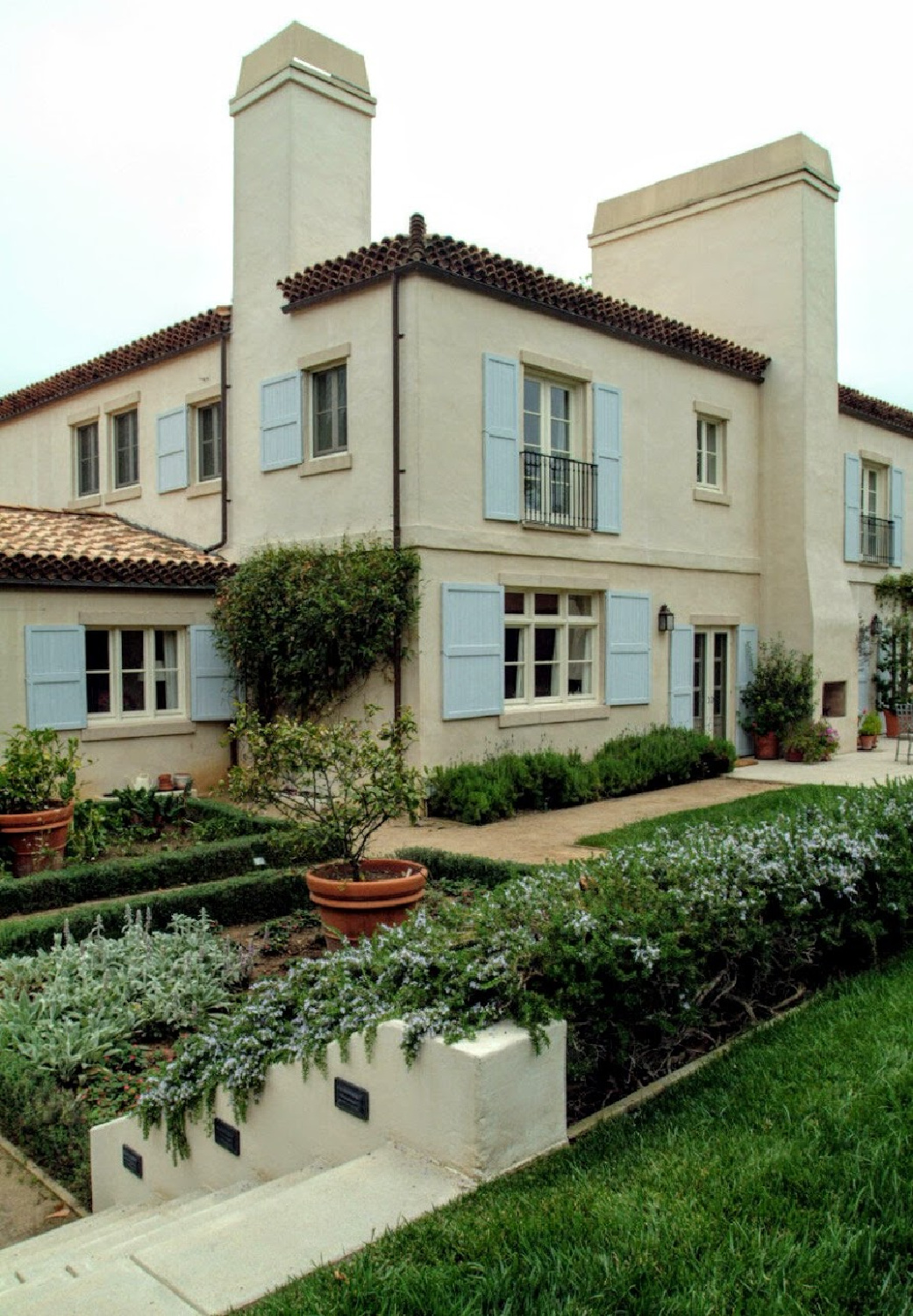 Nancy Meyers Provencal home in Los Angeles before renovation with its blue shutters.