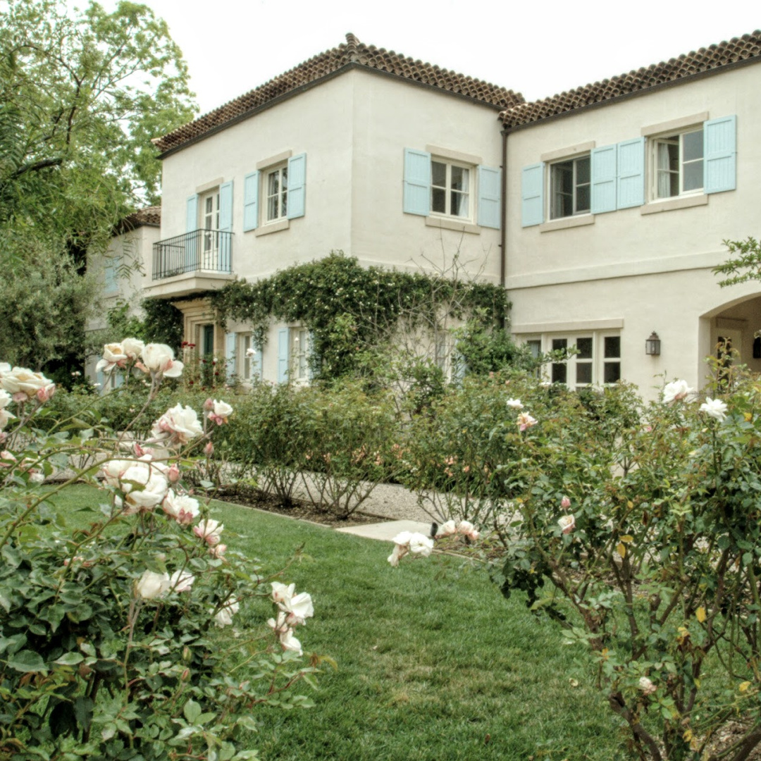 Nancy Meyers Provencal home in Los Angeles before renovation with its blue shutters.