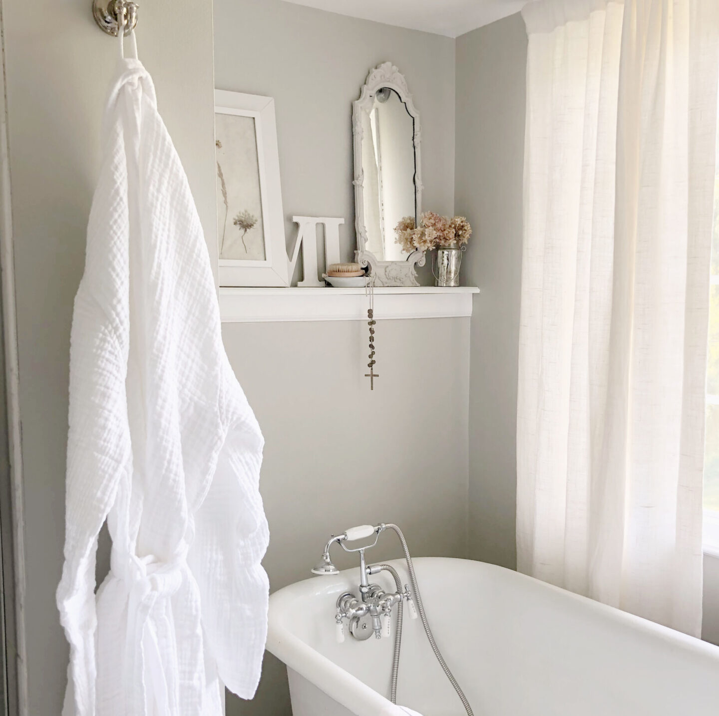 Serene bath with clawfoot tub and white Turkish muslin robe (Loom.ist) from Aware House. Wall color is SW Repose Gray - Hello Lovely Studio. #reposegray