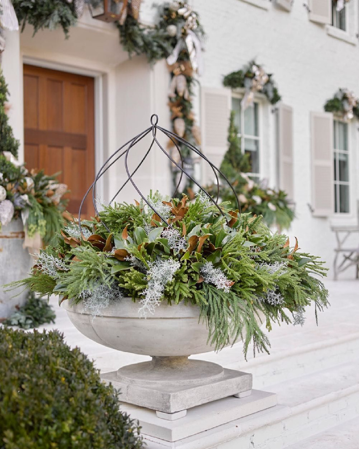 Atlanta Holiday Home exterior with magnificent greenery, wreaths, and Christmas planters (Boxwoods Atlanta). @atlantaholidayhome