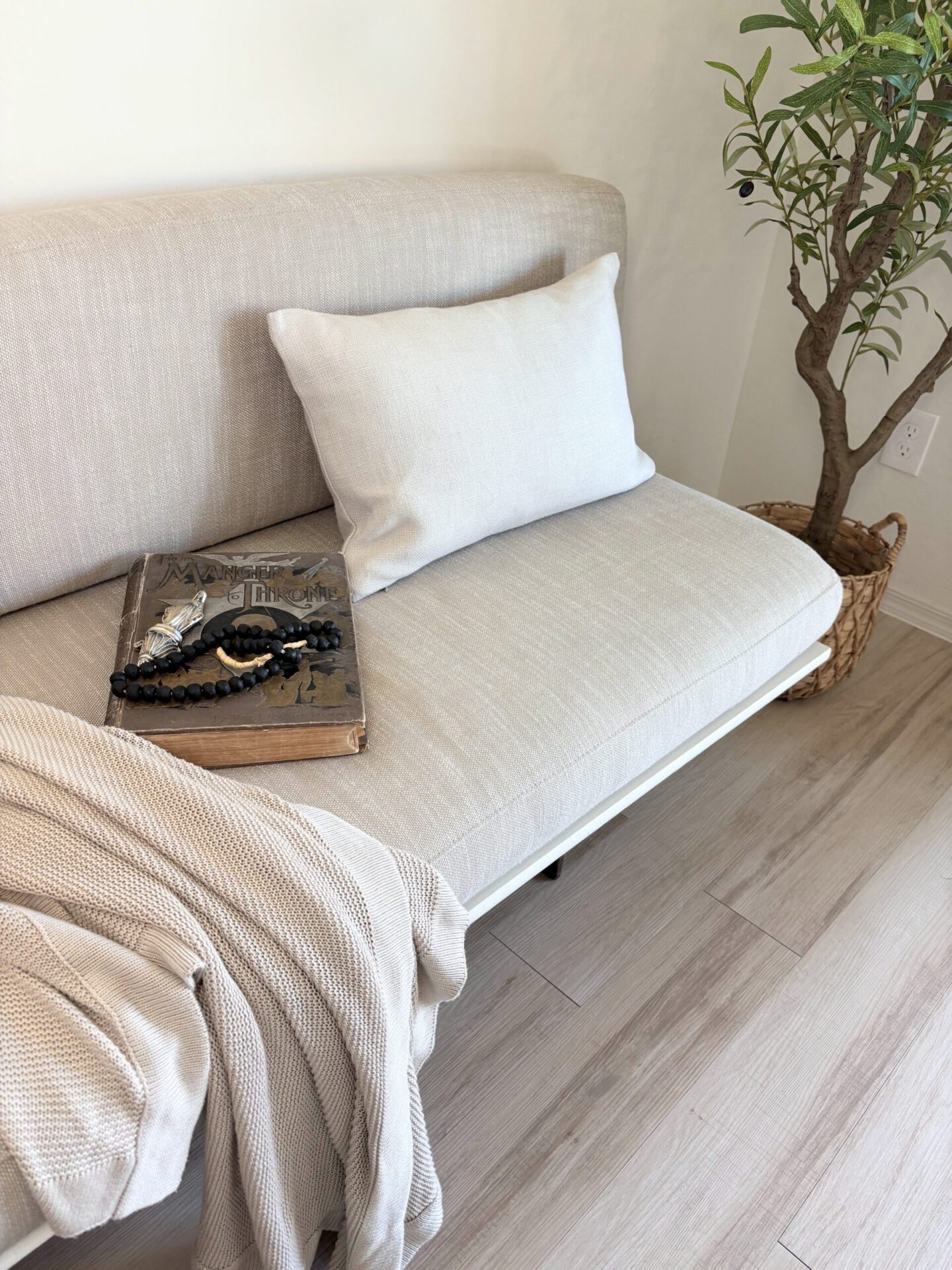 Linen Bench cushion and pillows (RH) on a DIY banquette we made for our dining area - Hello Lovely Studio.