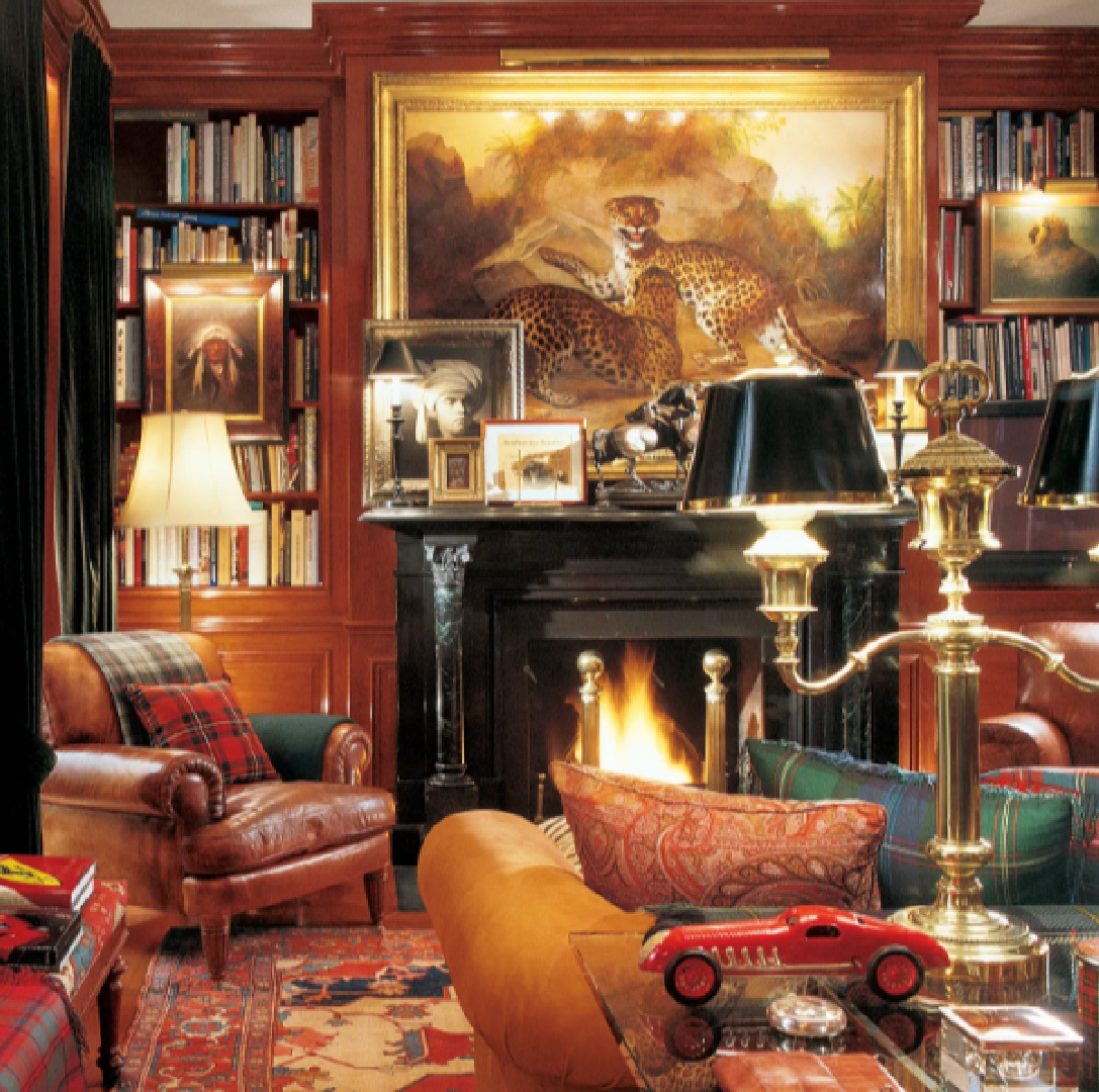 Ralph Lauren's classic cozy library with fireplace and warm colors - Architectural Digest.