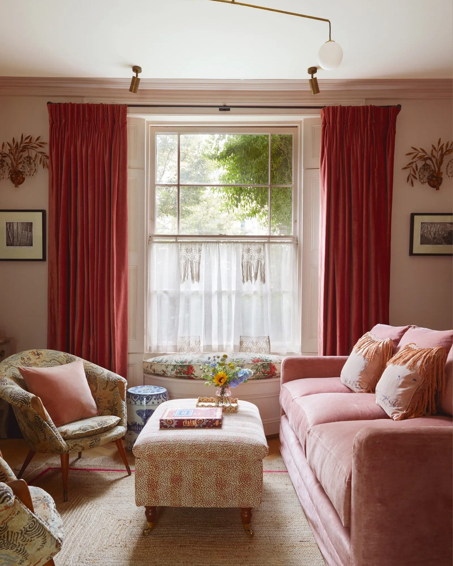Blush pink snug living room with British style and traditional comfort - House & Garden UK.