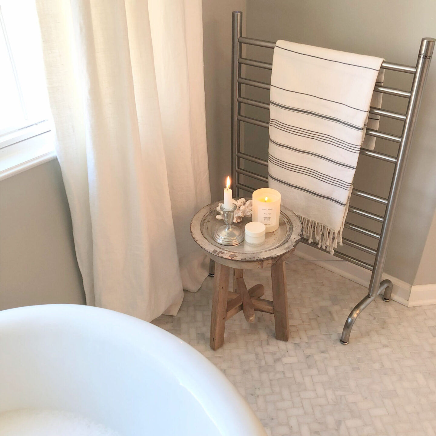 Hello Lovely's clawfoot tub and Amba towel warmer rack.