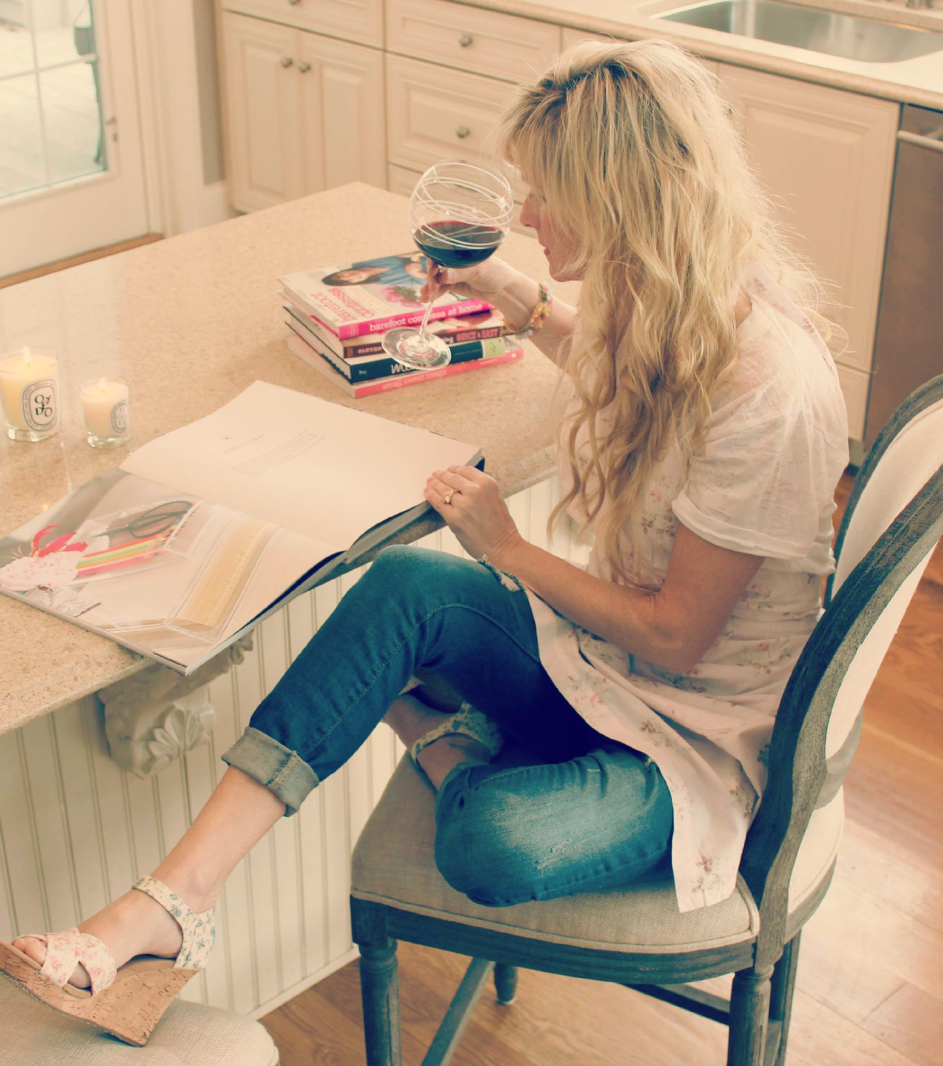 Hello Lovely's Michele in warm white kitchen in apron from Shabby Chic Couture.