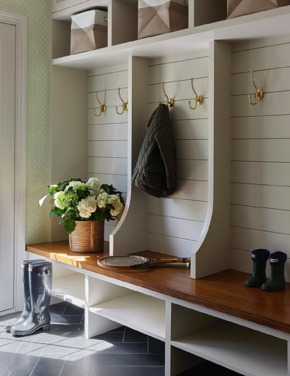 Serene, classic, and muted mudroom by M+M Interior Design (photo: Heather Talbert).