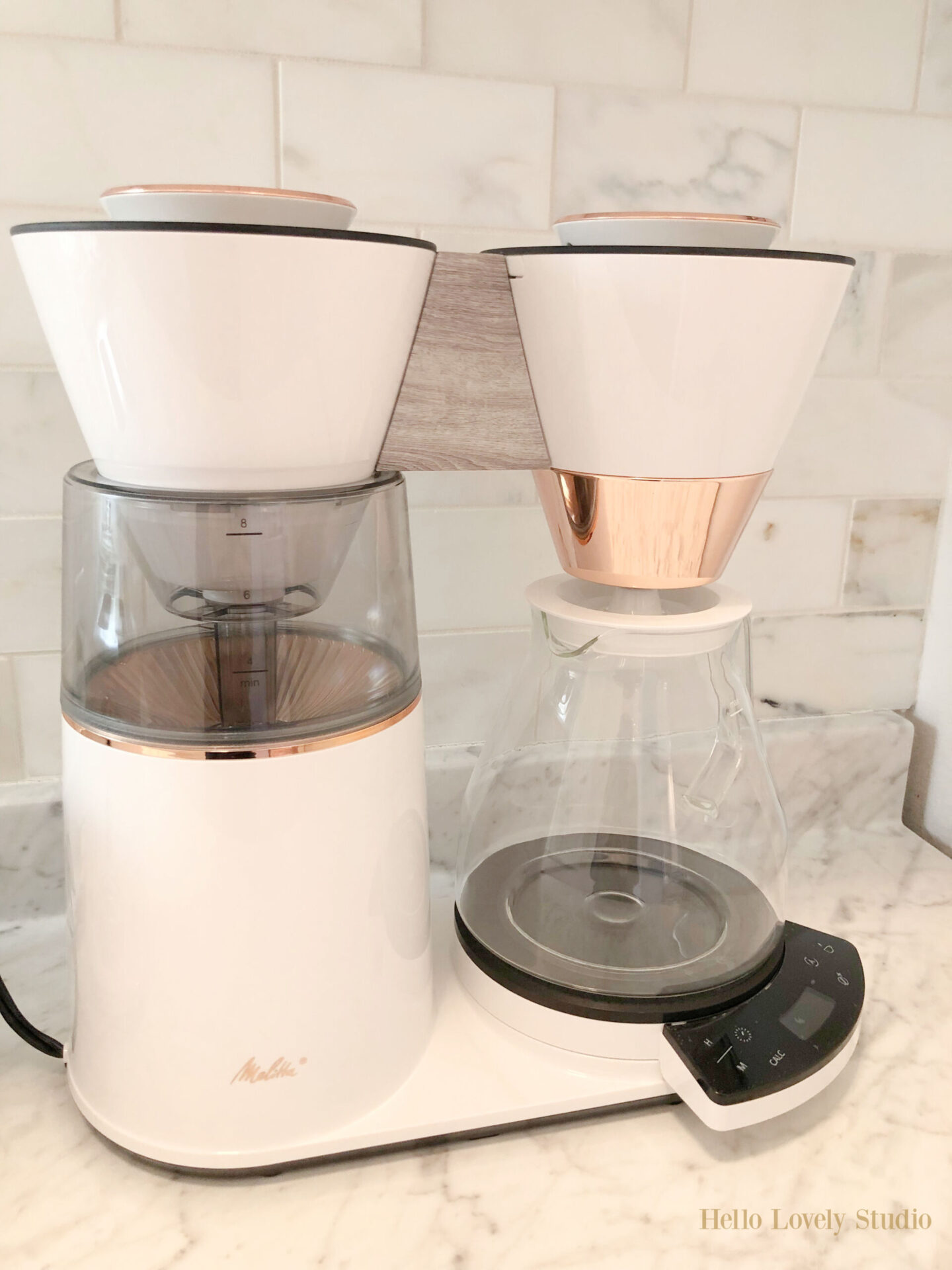 Ooh la la luxury with this Melitta Vision 12-cup coffee maker with 180 degree swivel dashboard! Love how the white and copper complement my modern French kitchen. #coffeemakers #kitchenelectronics #coffeelovers