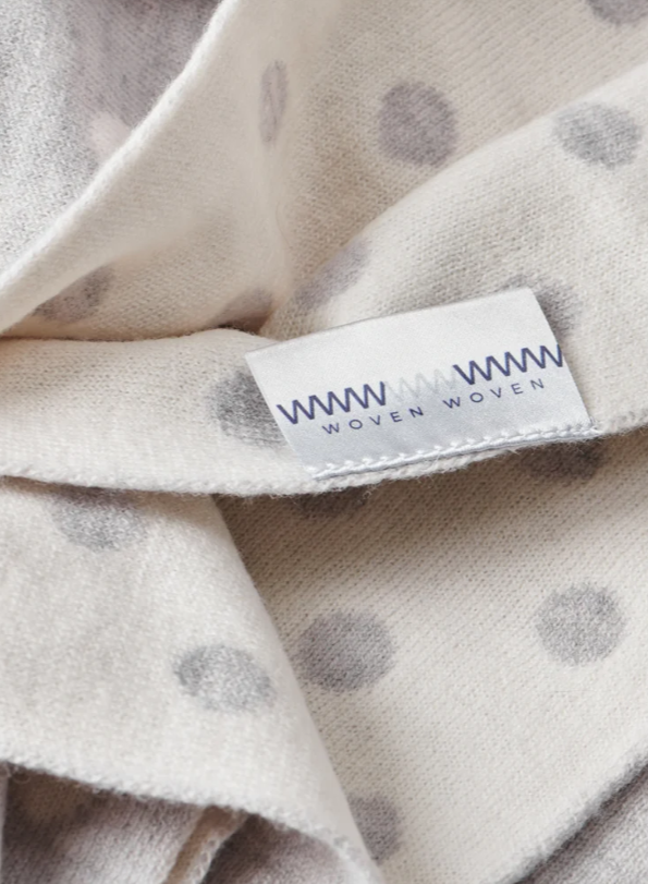 WovenWoven brand grey and white ultrafine Australian merino wool baby blanket with polka dots. #babyblankets #australianmerino #woolblankets