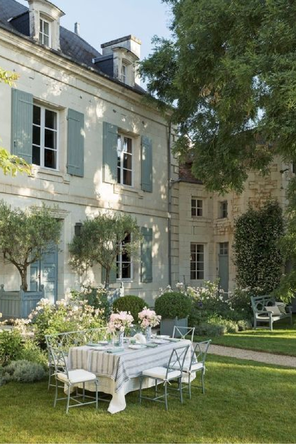 Beautiful European country manor house exterior with blue grey shutters and garden - @veranda.