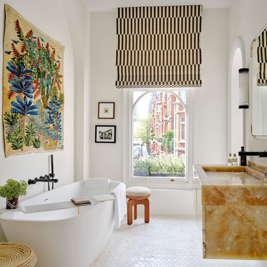 Magnificent bespoke bath with solid marble sink and vanity, soaking tub, tapestry, and geometric patterned shade - Benni Frowein/Frederic Magazine.