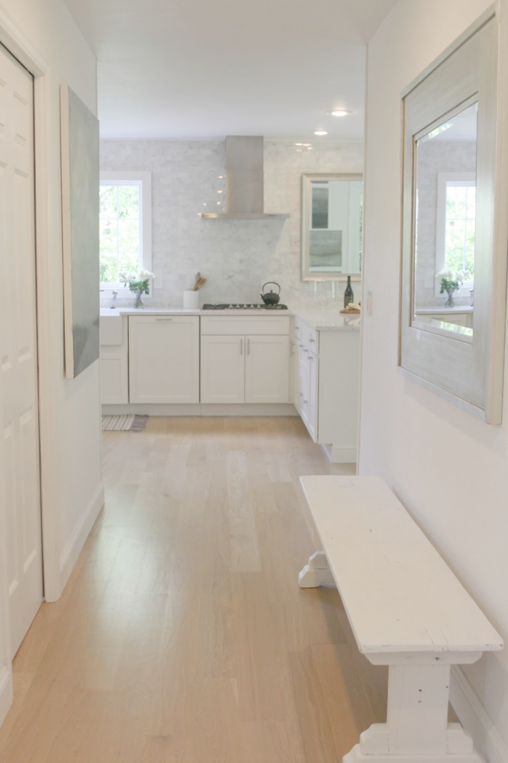White oak hardwood flooring in our hall - Hello Lovely. Walls are painted BM OC-151 White. #whiteoak