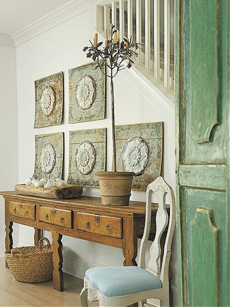 Green painted doors and elegant console table in a design by Shannon Bowers.