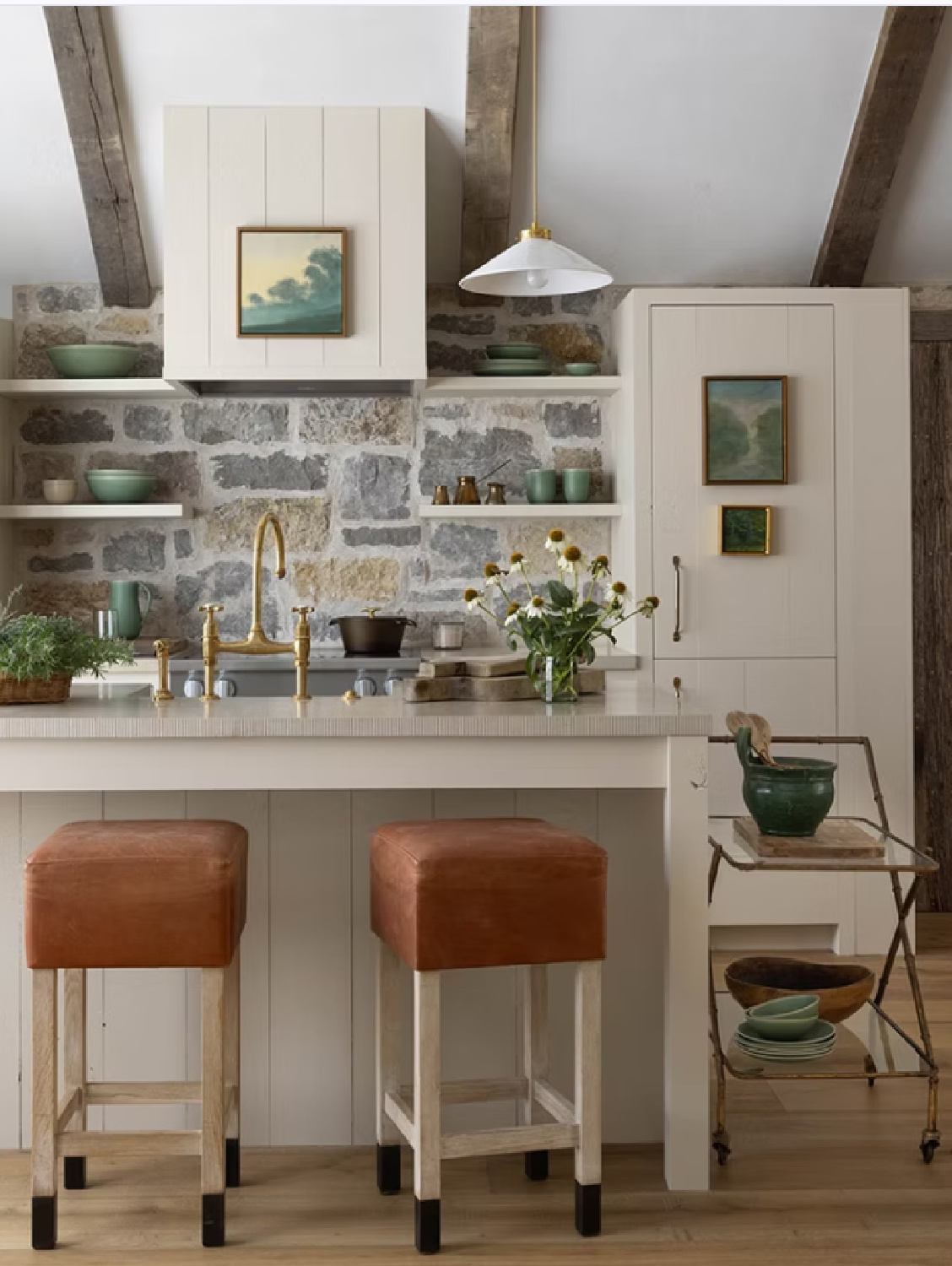 Stone wall backsplash with floating shelves in a rustic elegant Tennessee kitchen by Brooke Giannetti and Steve Giannetti for Patina Meadow. #patinahomeandgarden #naturalstone