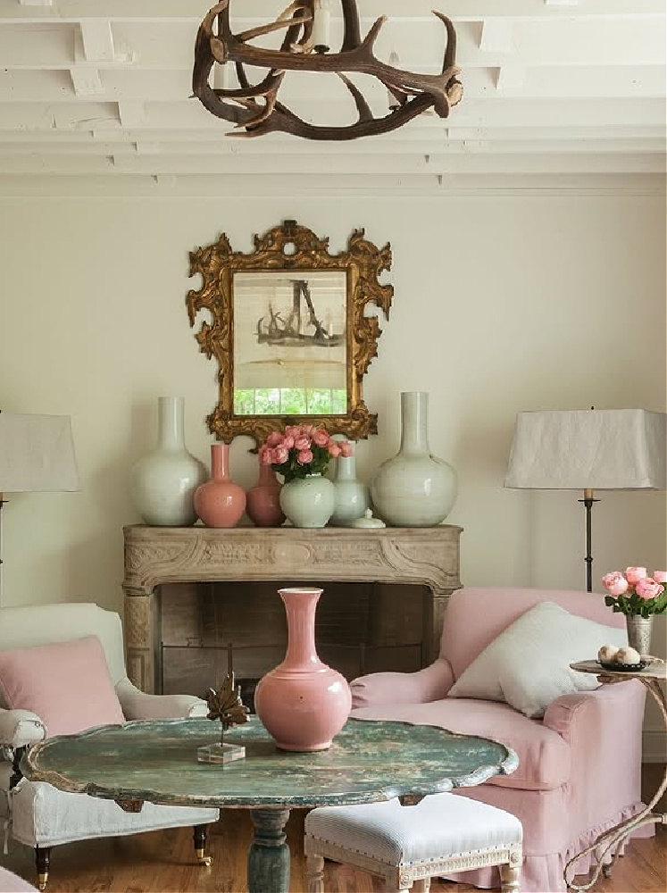 Shannon Bowers designed living room with antique French fireplace and timeless charm.
