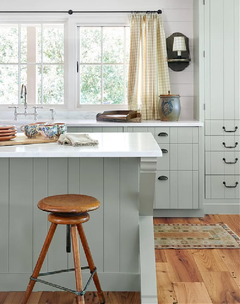 Shannon Bowers designed kitchen with light green and warm wood.