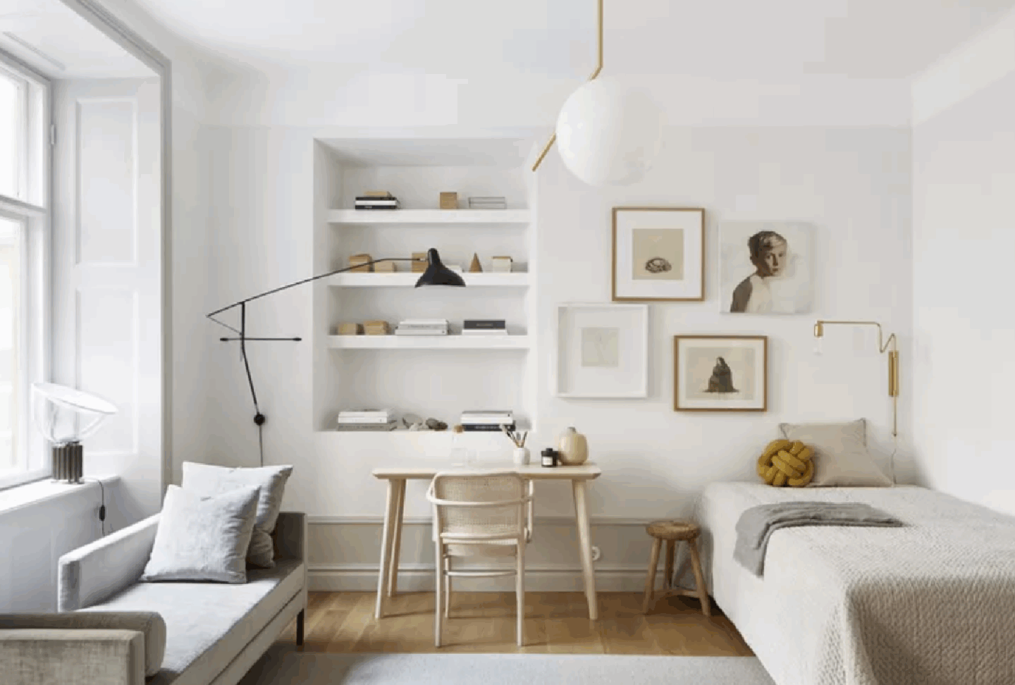 Modern Scandinavian style in a Stockholm apartment bedroom with white gallery wall and chic lighting (styling: Josefin Haag) - FANTASTIC FRANK Real Estate.