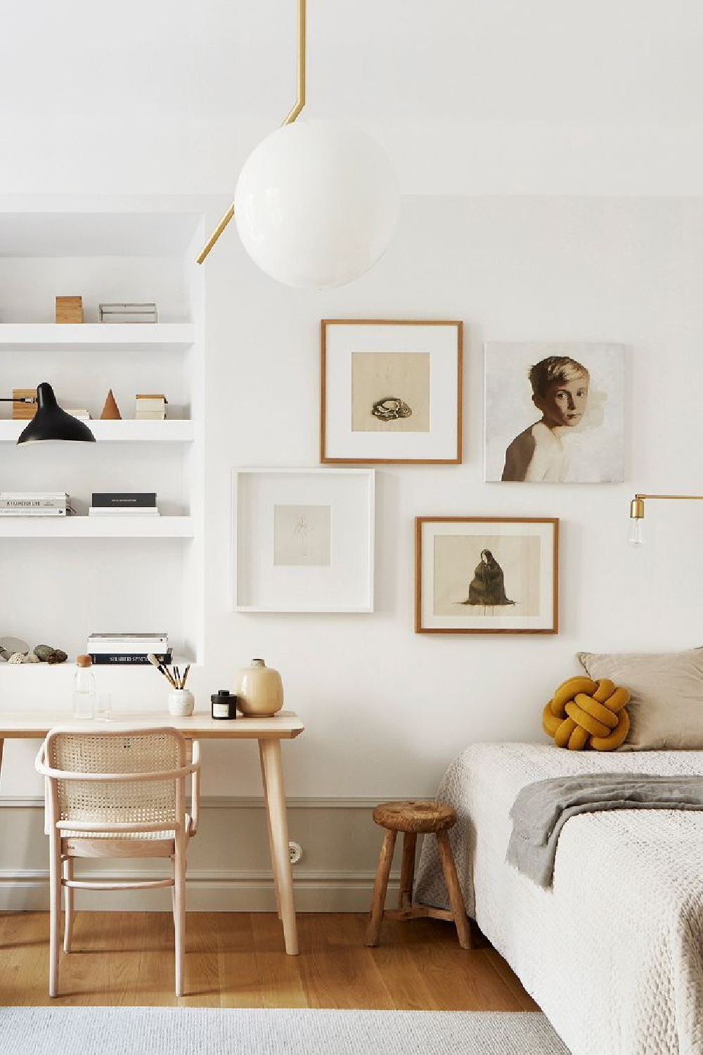 Modern Scandinavian style in a Stockholm apartment bedroom with white gallery wall and chic lighting (styling: Josefin Haag) - FANTASTIC FRANK Real Estate.