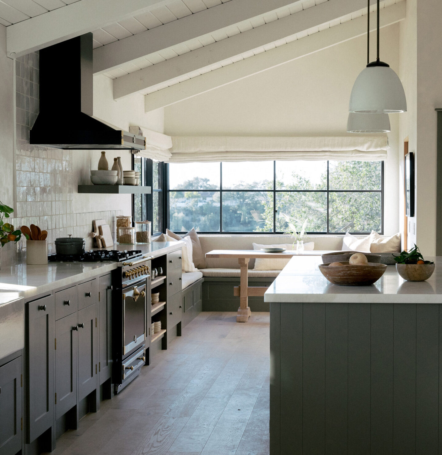 Jenni Kayne Home - beautiful kitchen with banquette at window.