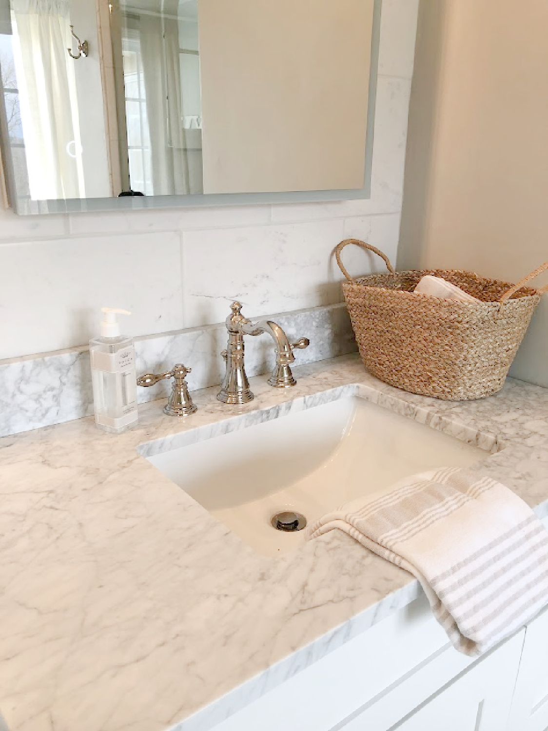 Hello Lovely's carrera marble topped vanity with Turkish towel.