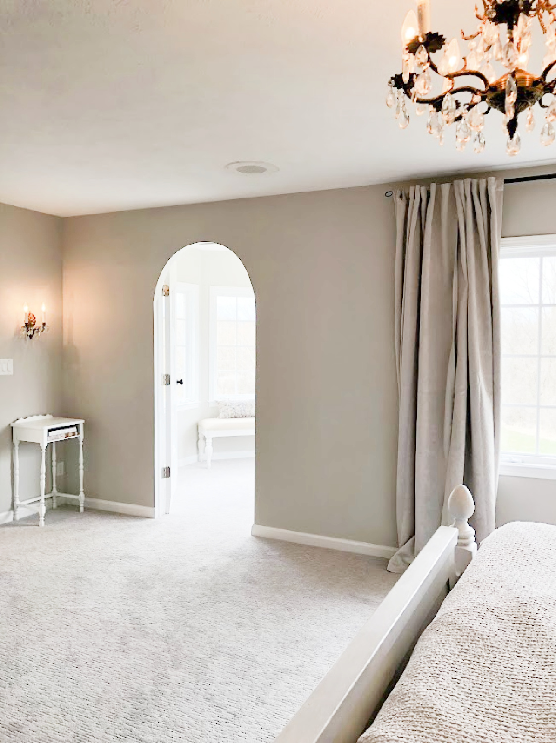 Hello Lovely's bedroom with SW Agreeable Gray and entrance to turret-shaped sitting room.