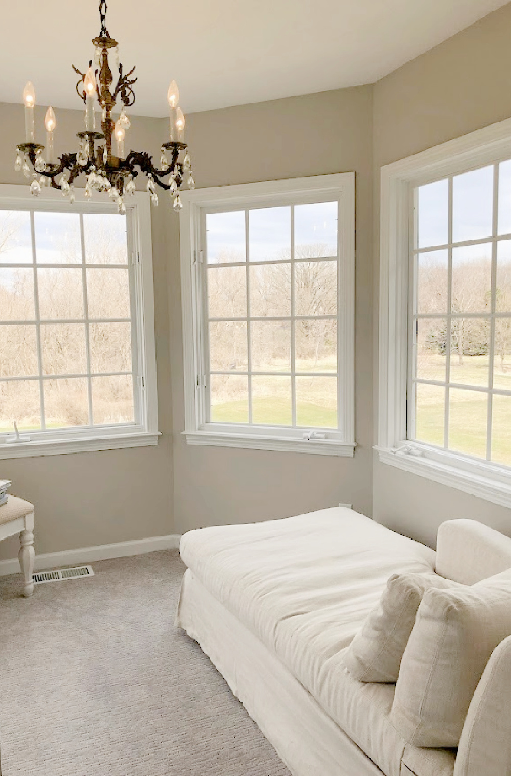 Hello Lovely's bedroom sitting room with view to forest in backyard.