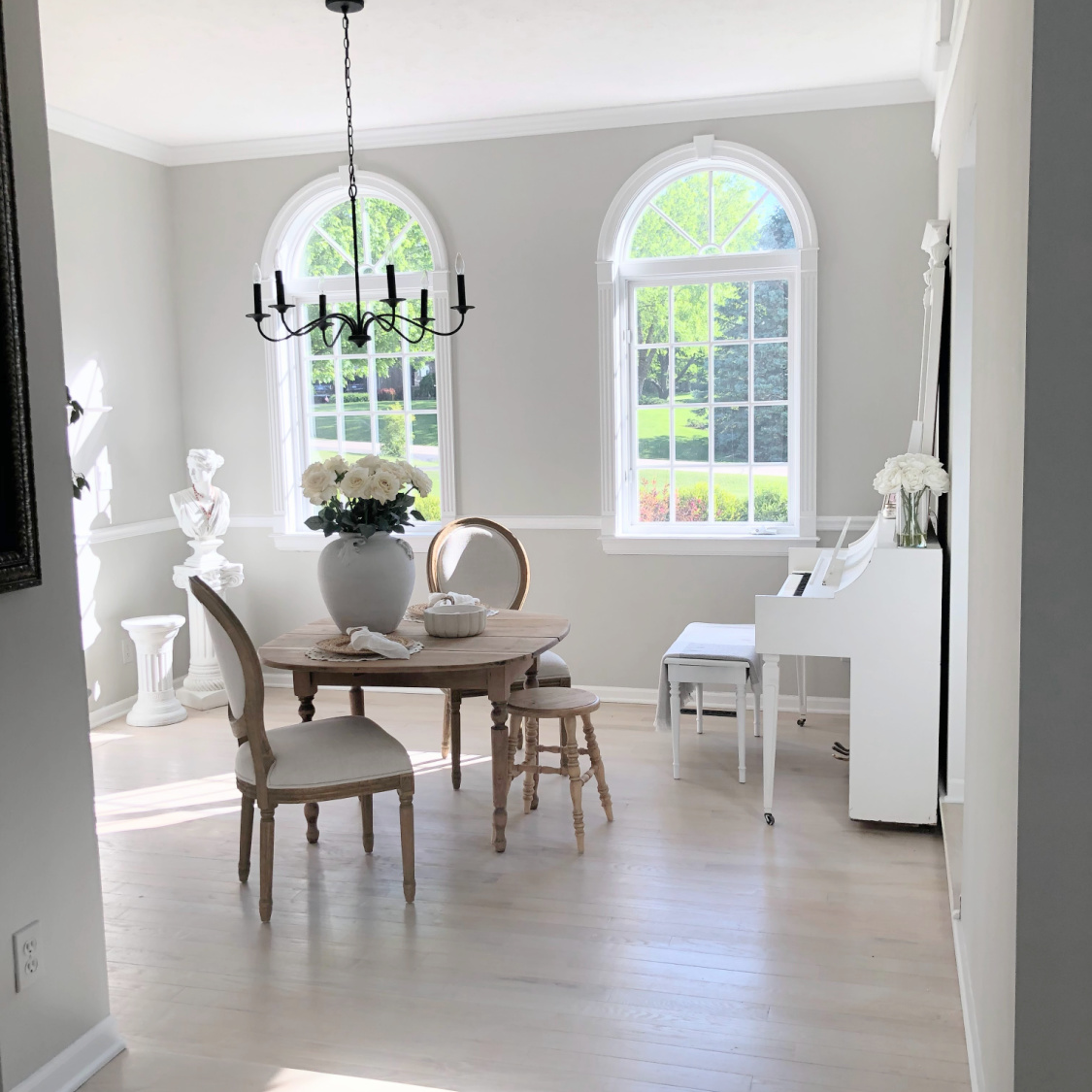 Hello Lovely's modern French dining room with arched windows and SW Repose Gray walls.