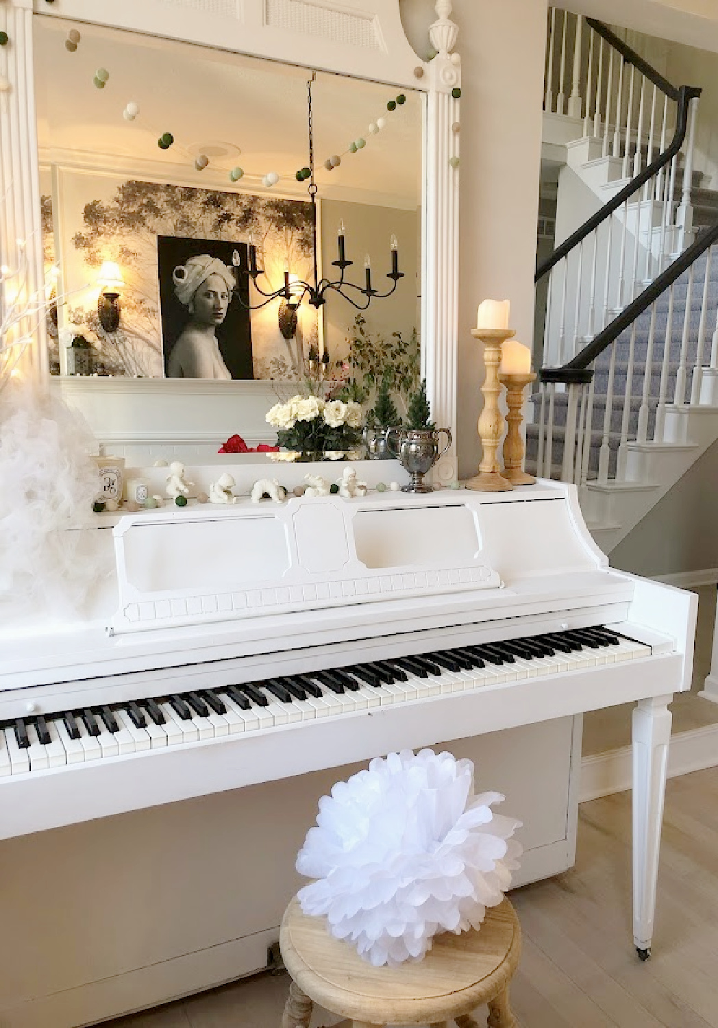 Hello Lovely's white Christmas decorated piano and dining room.