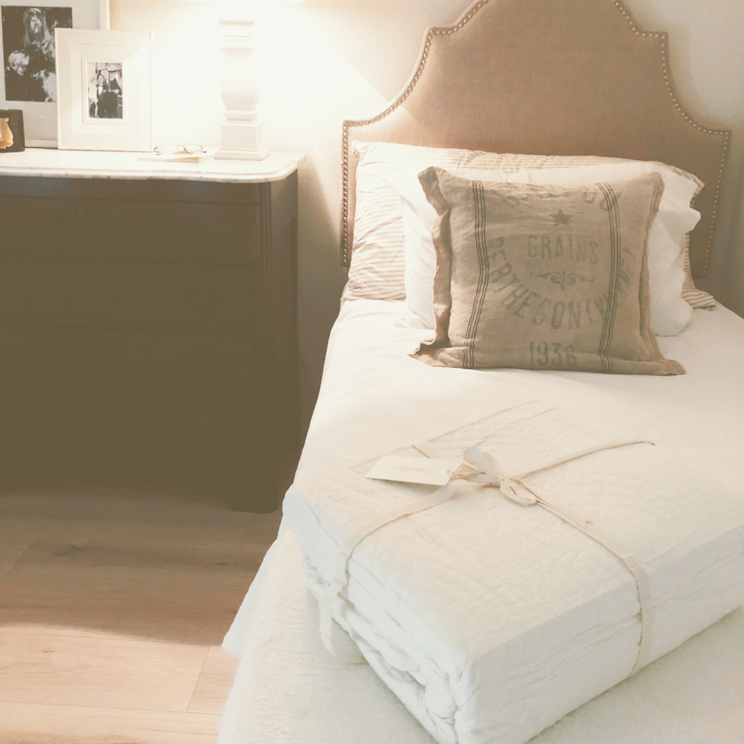 Hello Lovely's guest bedroom with modern French style and EVERGRACE Cotton Scallop Quilt Set in Ivory Cream. #whitebedding #evergrace