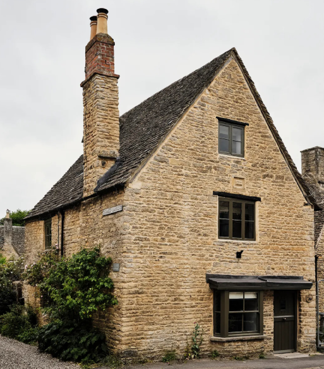Cotswolds stone cottage called Armada Cottage dates to 1489 with reimagined interiors by Beth Dadswell (Imperfect Interiors). Photo by Dean Hearne for Domino.
