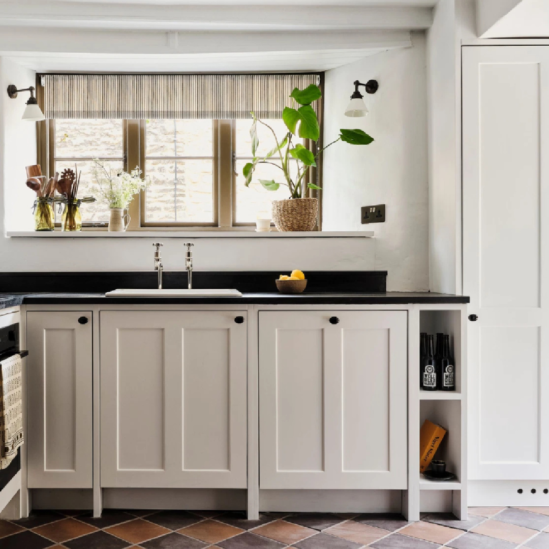 Lovely Shaker style English country kitchen. This Cotswolds stone cottage called Armada Cottage dates to 1489 with reimagined interiors by Beth Dadswell (Imperfect Interiors).
